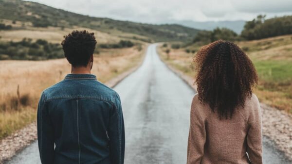 A couple standing before a road, needing to make a choice